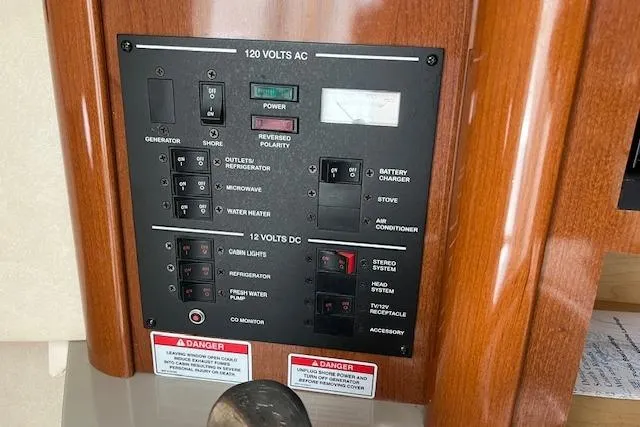 Slide: The Image of Electrical control panel on a 2008 Sea Ray 240 Sundancer boat. - 17
