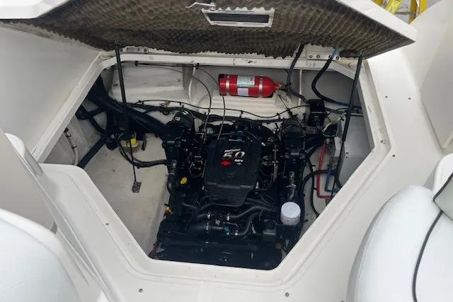 Slide: The Image of Engine compartment of a 2008 Sea Ray 240 Sundancer boat with visible fire extinguisher. - 21