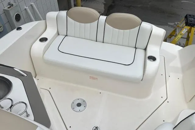 Slide: The Image of 2008 Sea Ray 240 Sundancer boat interior with white seating and cup holders. - 7