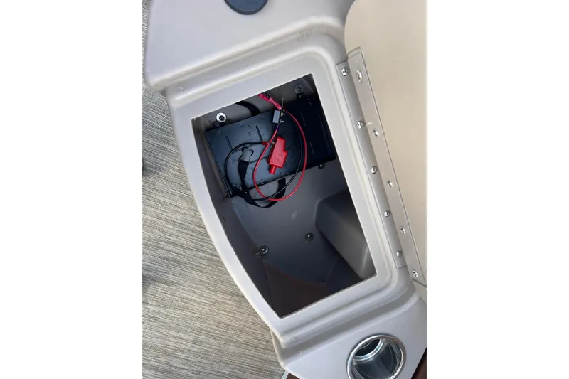 Slide: The Image of Open storage compartment in 2021 Bennington 168 FISH CRUISE boat with visible wiring. - 11