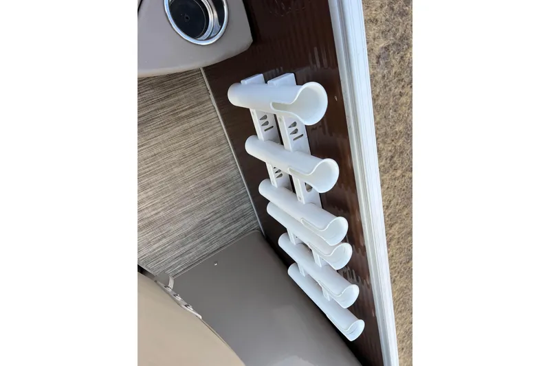 Slide: The Image of Rod holders on a 2021 Bennington 168 Fish Cruise boat interior. - 12