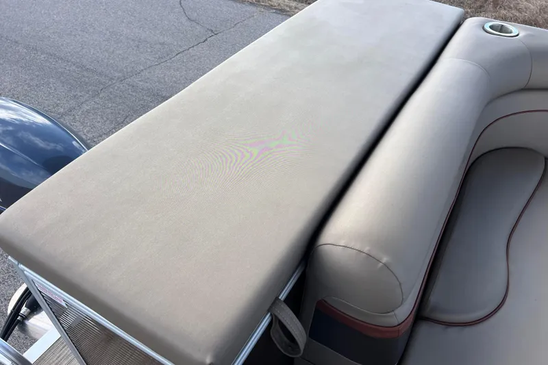 Slide: The Image of 2021 Bennington 168 FISH CRUISE boat with beige seating and cup holder. - 17