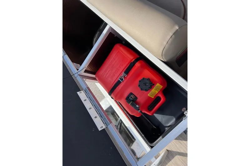Slide: The Image of Red fuel tank in storage compartment of 2021 Bennington 168 Fish Cruise boat. - 18