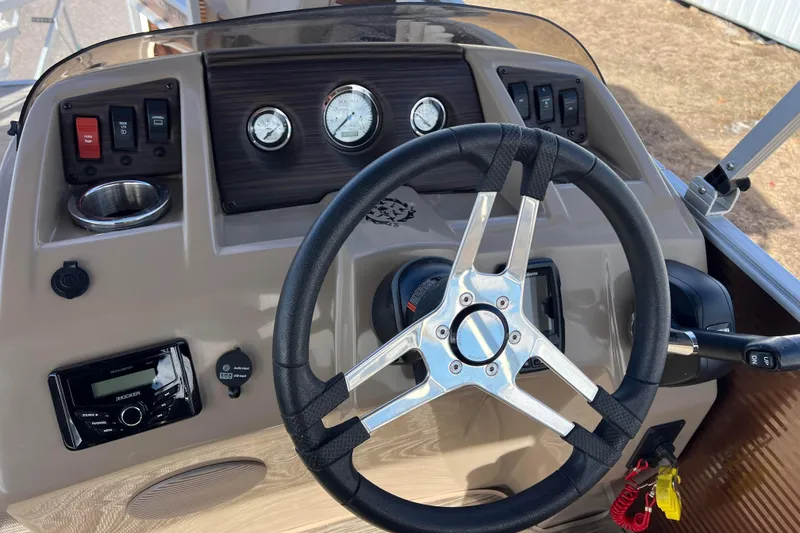 Slide: The Image of Steering console of a 2021 Bennington 168 Fish Cruise boat with gauges and controls. - 23