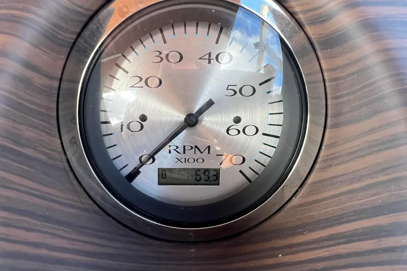 Slide: The Image of Close-up of a Bennington 168 Fish Cruise 2021 RPM gauge displaying 593 RPM. - 24