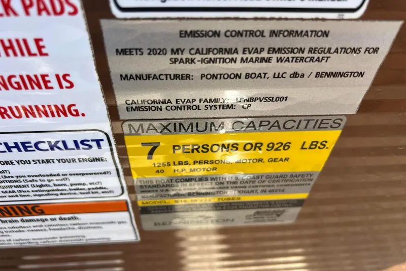 Slide: The Image of 2021 Bennington 168 FISH CRUISE capacity label, 7 persons or 926 lbs, emission info. - 27