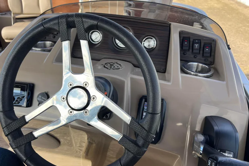 Slide: The Image of Steering wheel and dashboard of 2021 Bennington 168 Fish Cruise boat. - 28
