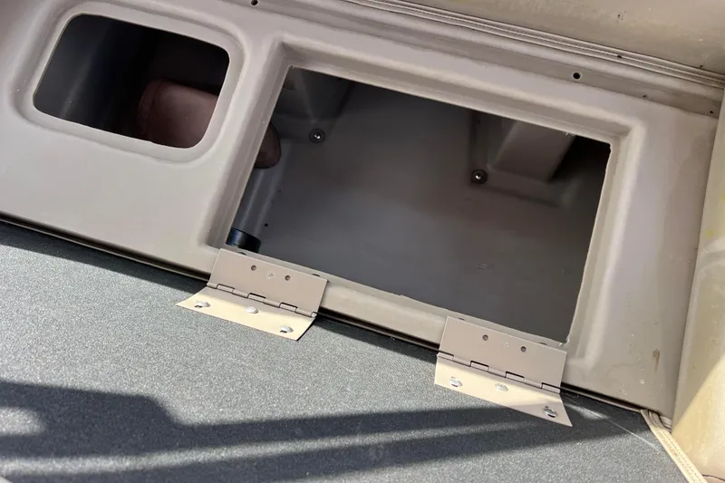 Slide: The Image of Open storage compartment on a 2021 Bennington 168 FISH CRUISE boat. - 30