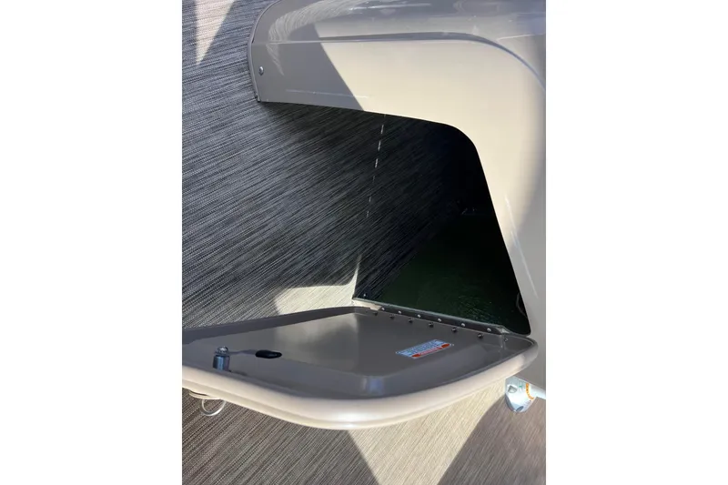 Slide: The Image of Open storage compartment on a 2021 Bennington 168 Fish Cruise boat. - 32