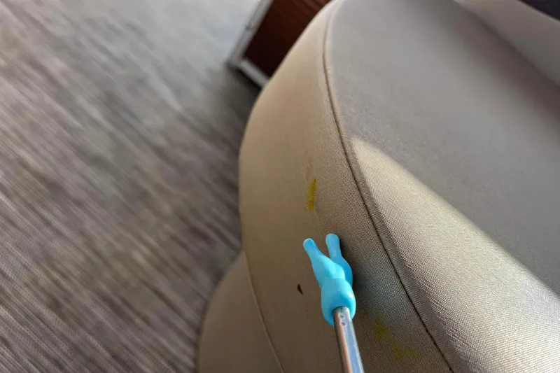 Slide: The Image of Blue tool pointing at stain on Bennington 168 FISH CRUISE 2021 seat. - 36