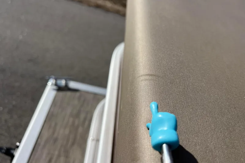 Slide: The Image of Close-up of a 2021 Bennington 168 FISH CRUISE boat seat with a blue pointer. - 37