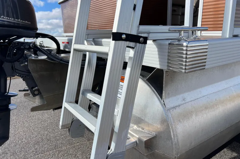 Slide: The Image of 2021 Bennington 168 Fish Cruise pontoon boat with ladder and outboard motor. - 46