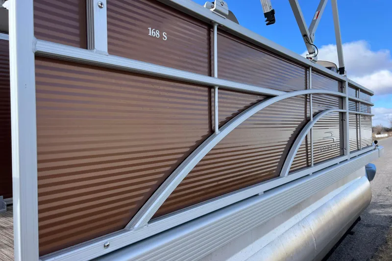 Slide: The Image of 2021 Bennington 168 FISH CRUISE pontoon boat with brown paneling and silver trim. - 47