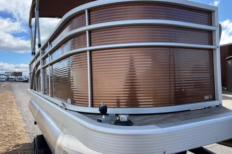 Slide: The Image of 2021 Bennington 168 FISH CRUISE pontoon boat with brown paneling and aluminum rails. - 51