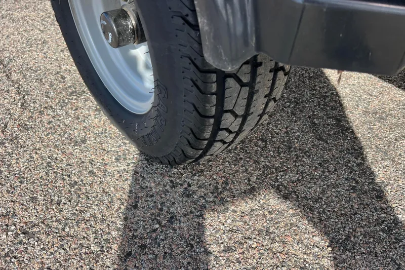 Slide: The Image of Close-up of a 2021 Bennington 168 FISH CRUISE trailer tire on asphalt. - 55