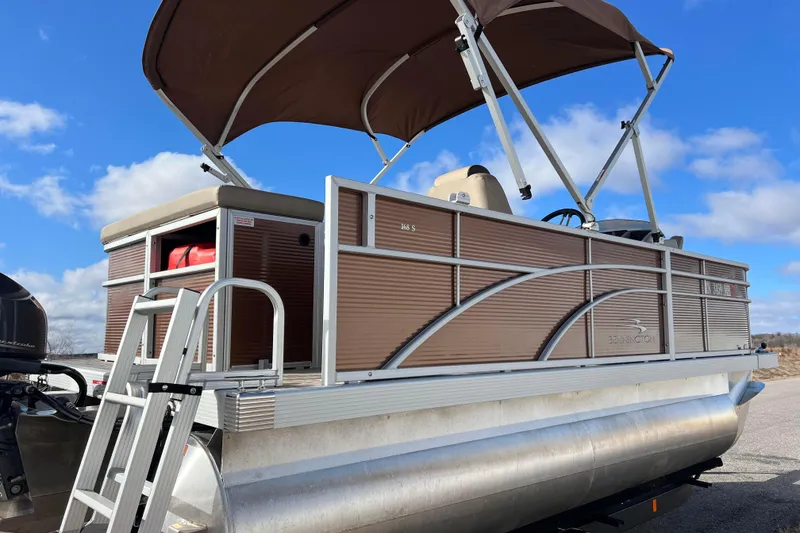 Slide: The Image of 2021 Bennington 168 FISH CRUISE pontoon boat with canopy on a sunny day. - 6