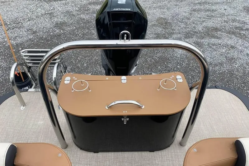 Slide: The Image of 2024 Avalon Catalina 2585 RL boat deck with Mercury engine and seating area. - 14