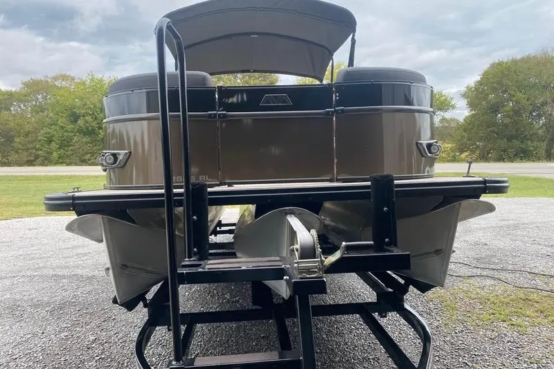 Slide: The Image of 2024 Avalon Catalina 2585 RL pontoon boat on trailer, rear view. - 2