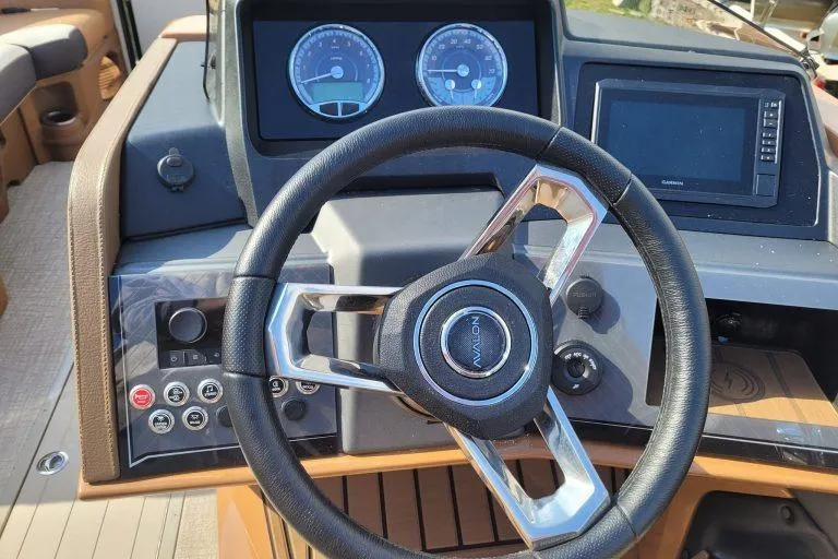 Slide: The Image of Steering wheel and dashboard of 2024 Avalon Catalina 2585 RL boat. - 8