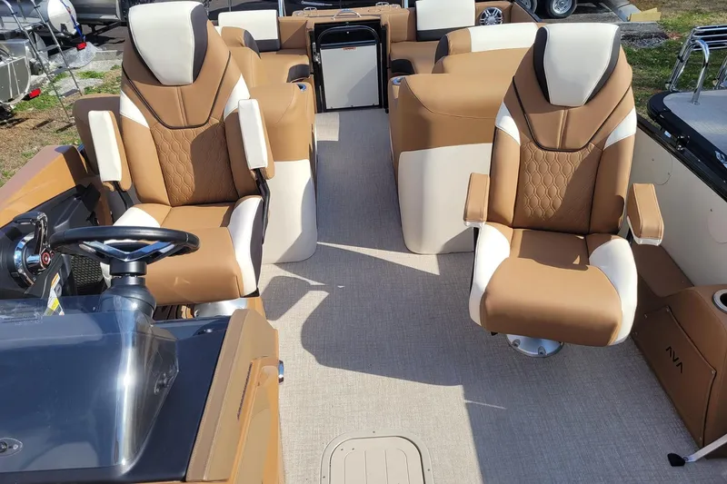 Slide: The Image of Luxurious interior of 2024 Avalon Catalina 2585 RL boat with plush seating and steering console. - 9