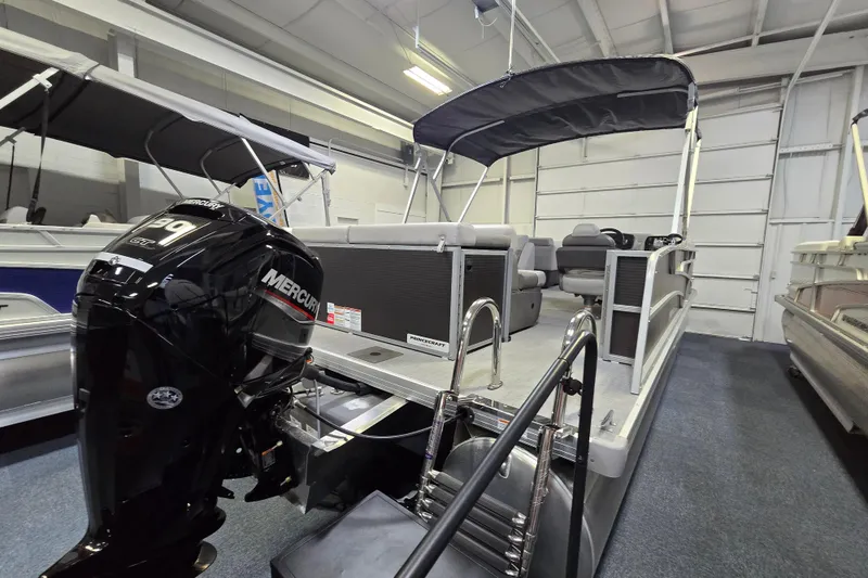 Slide: The Image of 2026 Princecraft Vectra 23 L pontoon boat with Mercury engine in showroom. - 3