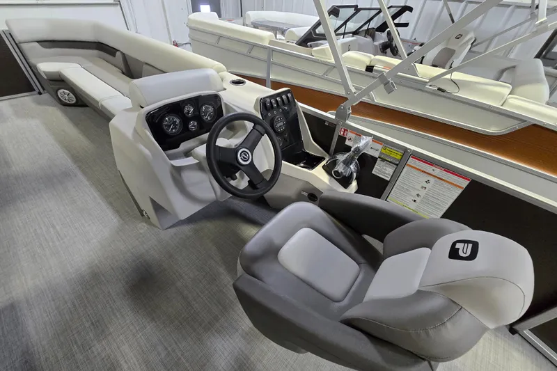 Slide: The Image of 2026 Princecraft Vectra 23 L boat interior with steering console and seating. - 4