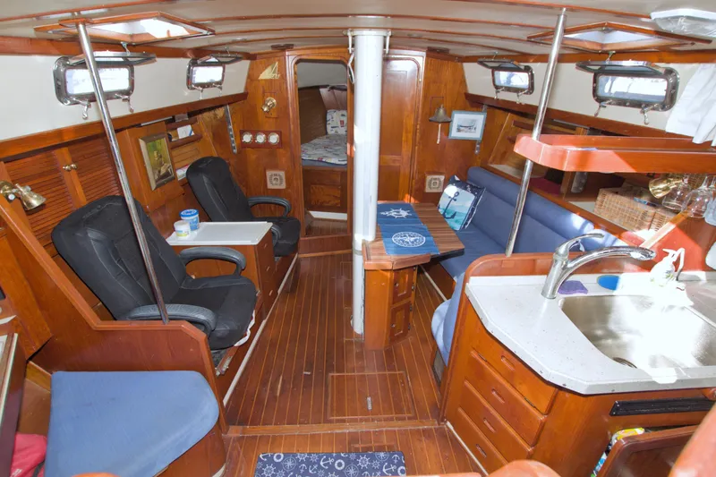 Slide: The Image of Interior of 1987 Morgan 43 CC sailboat with wood finish and seating area. - 30