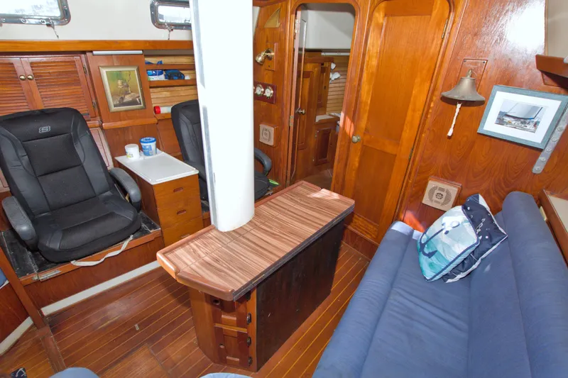 Slide: The Image of Interior of 1987 Morgan 43 CC sailboat with wooden furnishings and seating area. - 40