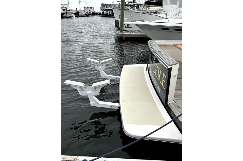 Slide: The Image of 2006 Sabre 38 Hard Top Express docked with swim platform and davit system. - 19