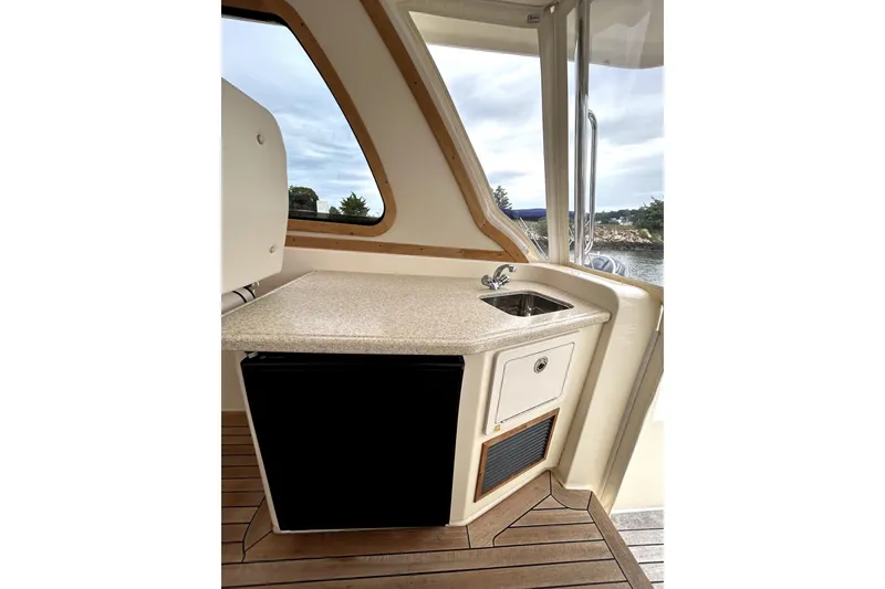 Slide: The Image of 2006 Sabre 38 Hard Top Express yacht interior with kitchenette and sink. - 9