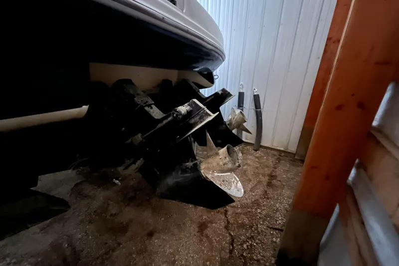 Slide: The Image of 2003 Sea Ray 290 Bowrider boat propellers in a storage area. - 36