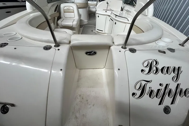 Slide: The Image of 2003 Sea Ray 290 Bowrider interior with seating and "Bay Tripper" text. - 6