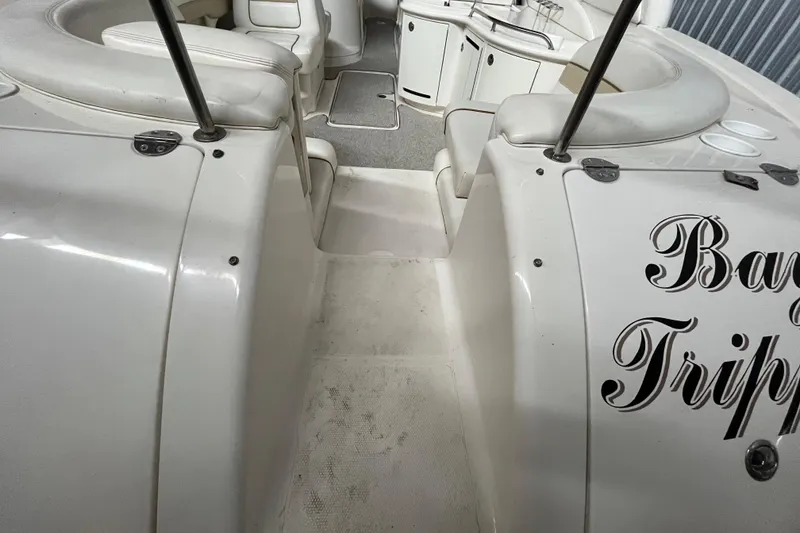 Slide: The Image of 2003 Sea Ray 290 Bowrider interior with seating and storage compartments. - 7