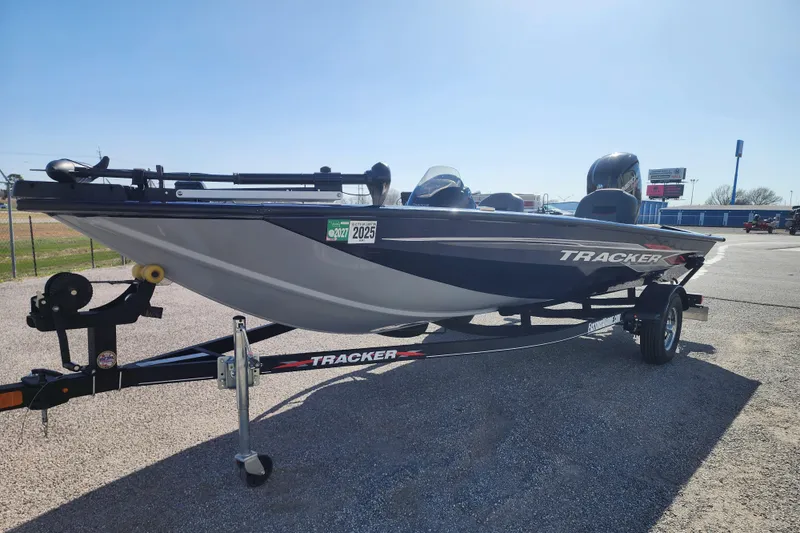 Slide: The Image of 2022 Tracker Pro Team 175 boat on trailer in outdoor setting. - 2