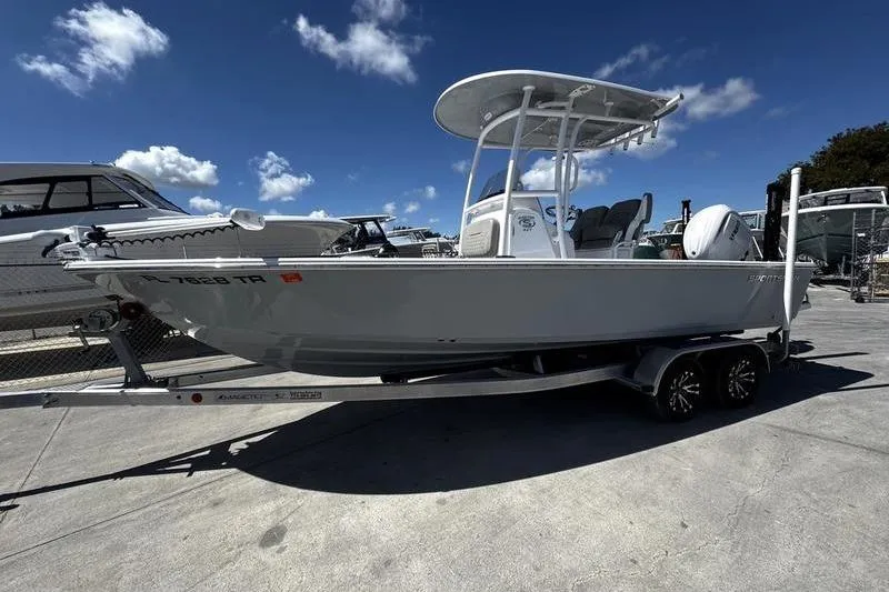 The Image of 2024 SPORTMAN MASTERS 227 boat on trailer under clear blue sky. - 1