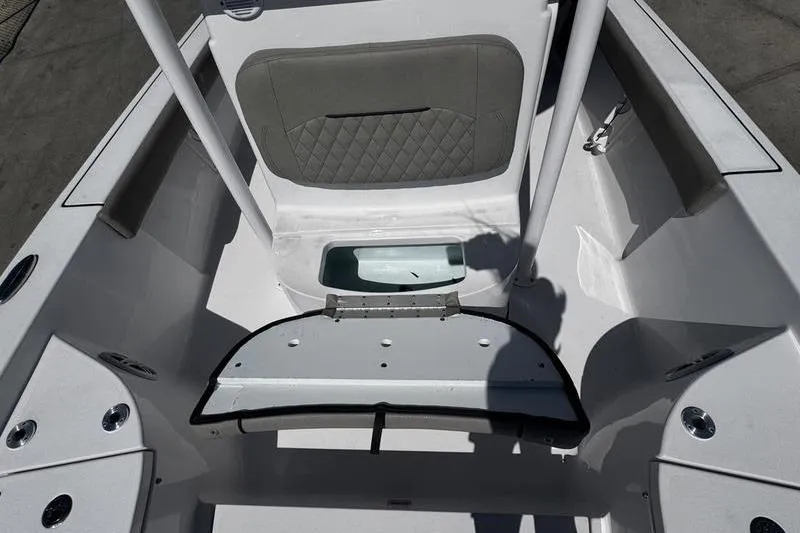 Slide: The Image of 2024 SPORTMAN MASTERS 227 boat interior with open storage compartment. - 14