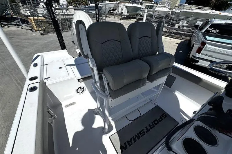 Slide: The Image of 2024 SPORTMAN MASTERS 227 boat interior with dual gray seats and console. - 20