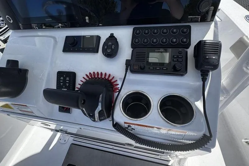 Slide: The Image of Control panel of 2024 SPORTMAN MASTERS 227 boat with navigation and communication equipment. - 25