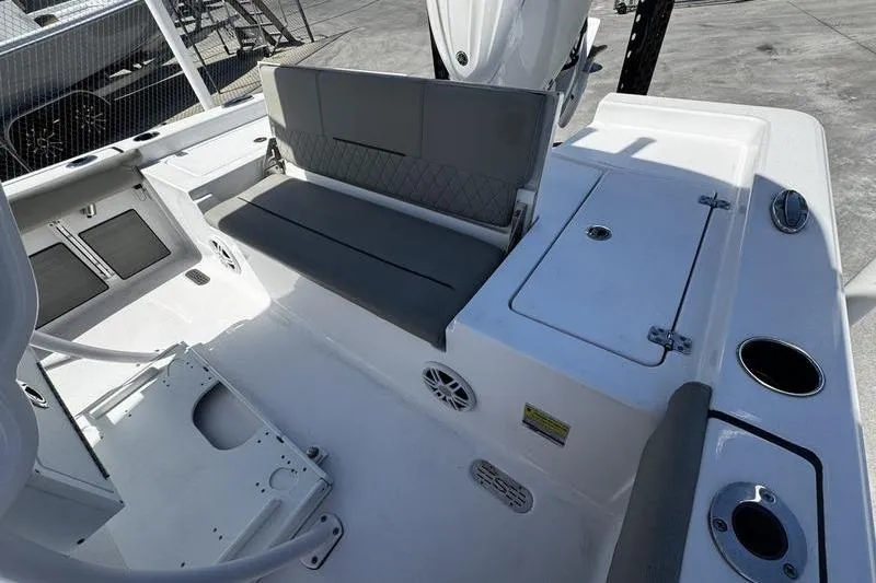 Slide: The Image of 2024 SPORTMAN MASTERS 227 boat interior with seating and storage compartments. - 28