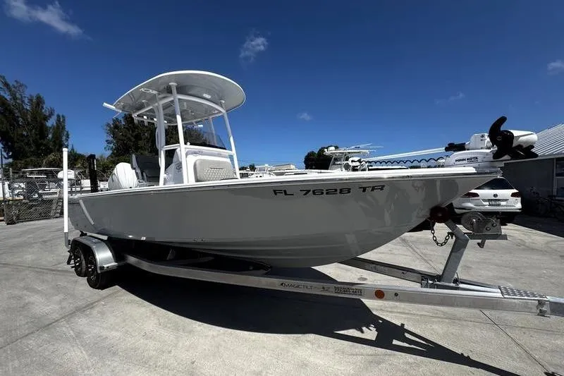 Slide: The Image of 2024 SPORTMAN MASTERS 227 boat on trailer under clear blue sky. - 3