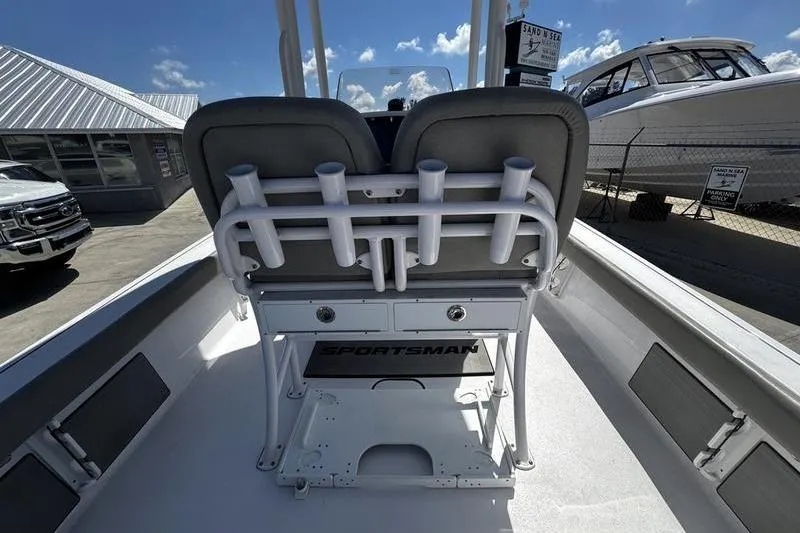 Slide: The Image of 2024 SPORTMAN MASTERS 227 boat interior with rod holders and seating. - 30