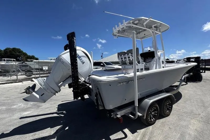 Slide: The Image of 2024 SPORTMAN MASTERS 227 boat on trailer, featuring Yamaha outboard motor under clear blue sky. - 5