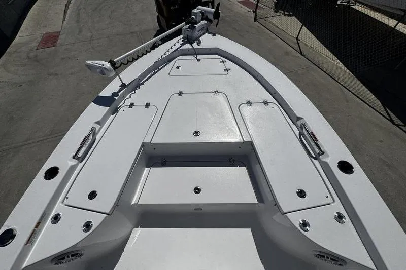Slide: The Image of 2024 SPORTMAN MASTERS 227 boat deck with storage compartments and trolling motor. - 8