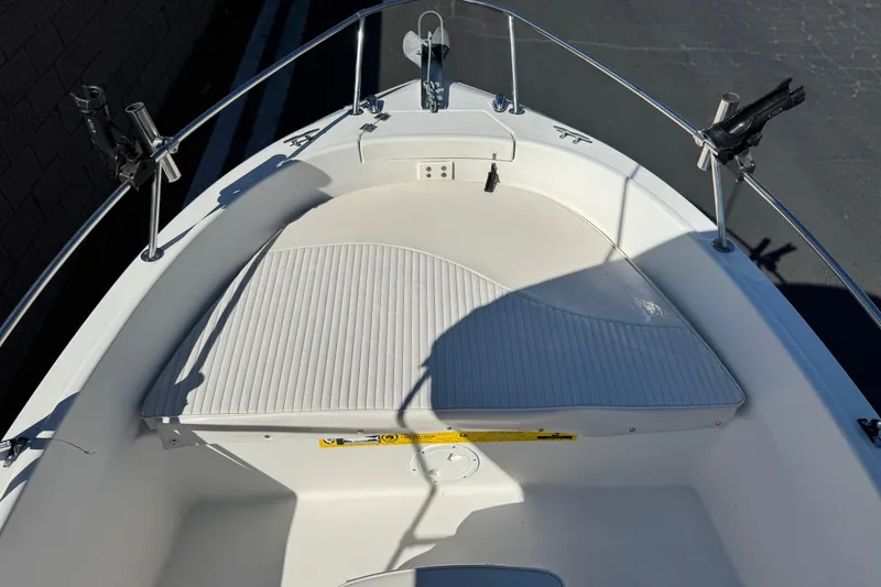 Slide: The Image of 2006 Seaswirl Striper 1851 Center Console O/B boat interior with rod holders and seating. - 10