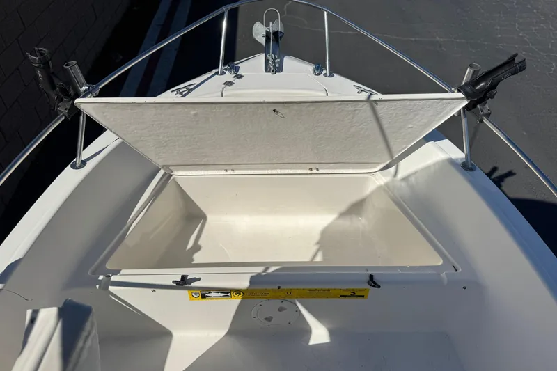 Slide: The Image of Open storage compartment on 2006 Seaswirl Striper 1851 Center Console boat. - 12