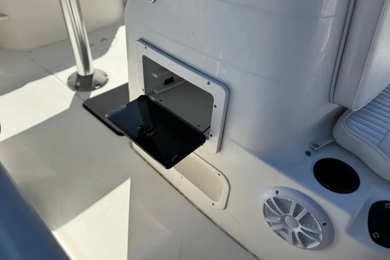 Slide: The Image of 2006 Seaswirl Striper 1851 Center Console interior with open storage compartment. - 15
