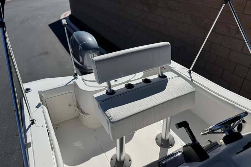 Slide: The Image of 2006 Seaswirl Striper 1851 Center Console O/B boat interior with seating and steering wheel. - 17