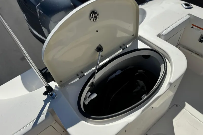 Slide: The Image of Open storage compartment on 2006 Seaswirl Striper 1851 Center Console boat. - 19