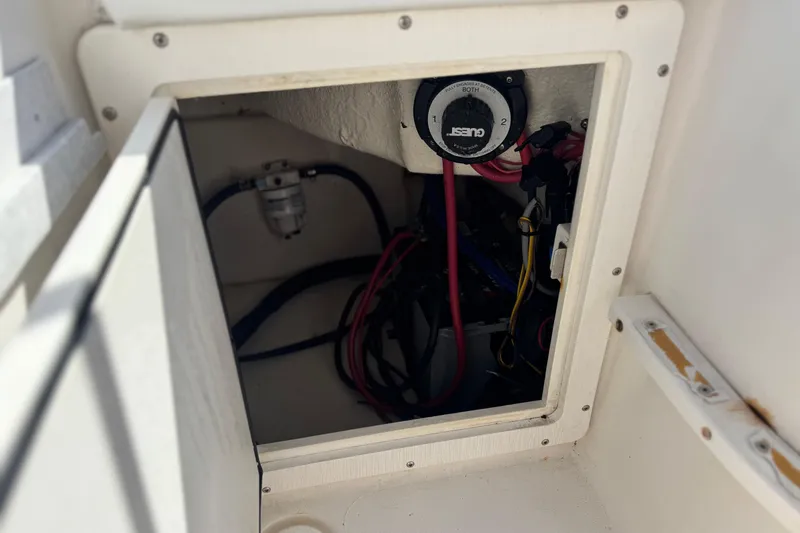 Slide: The Image of 2006 Seaswirl Striper 1851 Center Console O/B battery compartment with wiring and switch. - 21