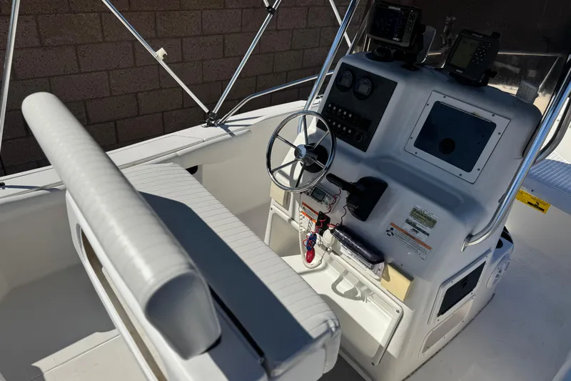 Slide: The Image of 2006 Seaswirl Striper 1851 Center Console O/B boat interior with steering wheel and controls. - 23